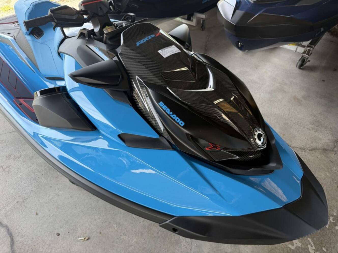 A photo of this 2026 Sea-Doo RXP-X 325 Tech, BRP Premium A, iBR Gulfstream Blue P