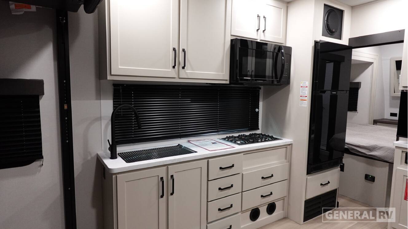 A photo of this 2026 Grand Design MOMENTUM 21G