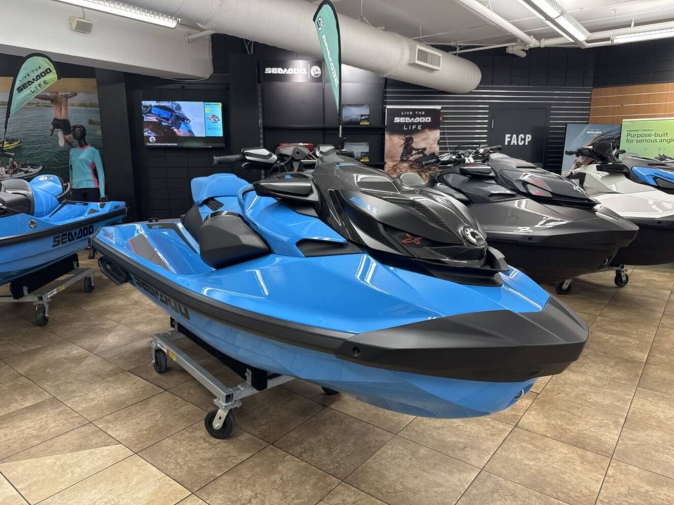 A photo of this 2026 Sea-Doo RXP-X 325 Tech, BRP Premium A, iBR Gulfstream Blue P