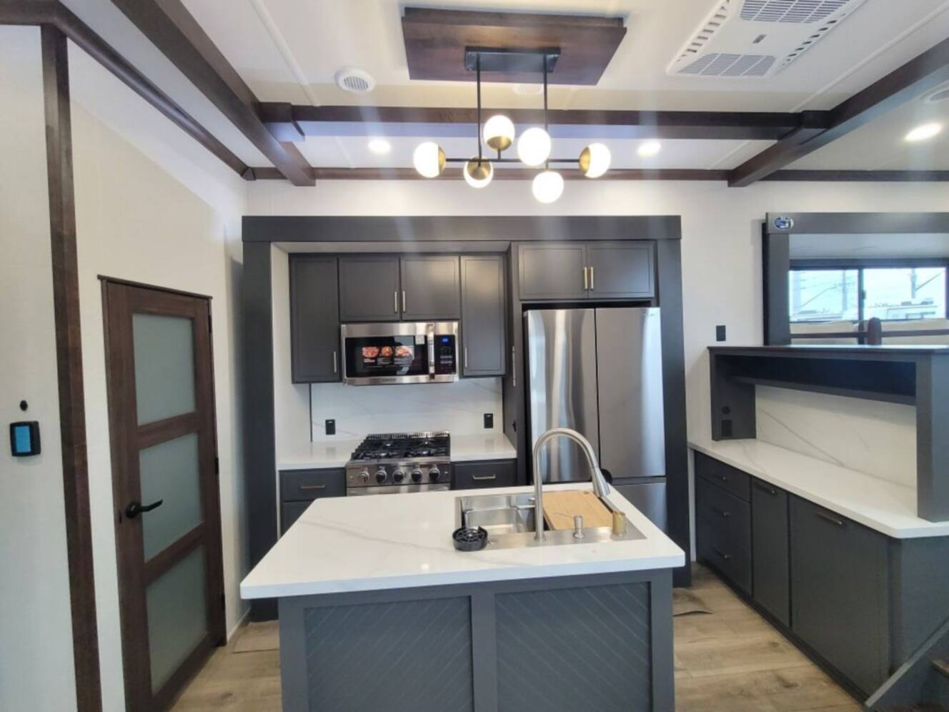 A photo of this 2027 Forest River Cedar Creek Cottage 413FWC