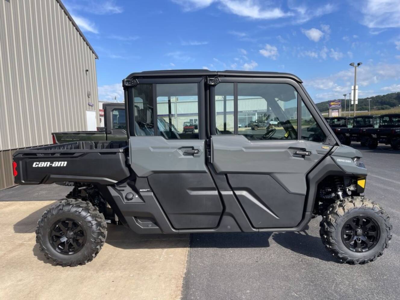 A photo of this 2027 Can-Am Defender MAX DPS CAB HD10 Dolomite Grey