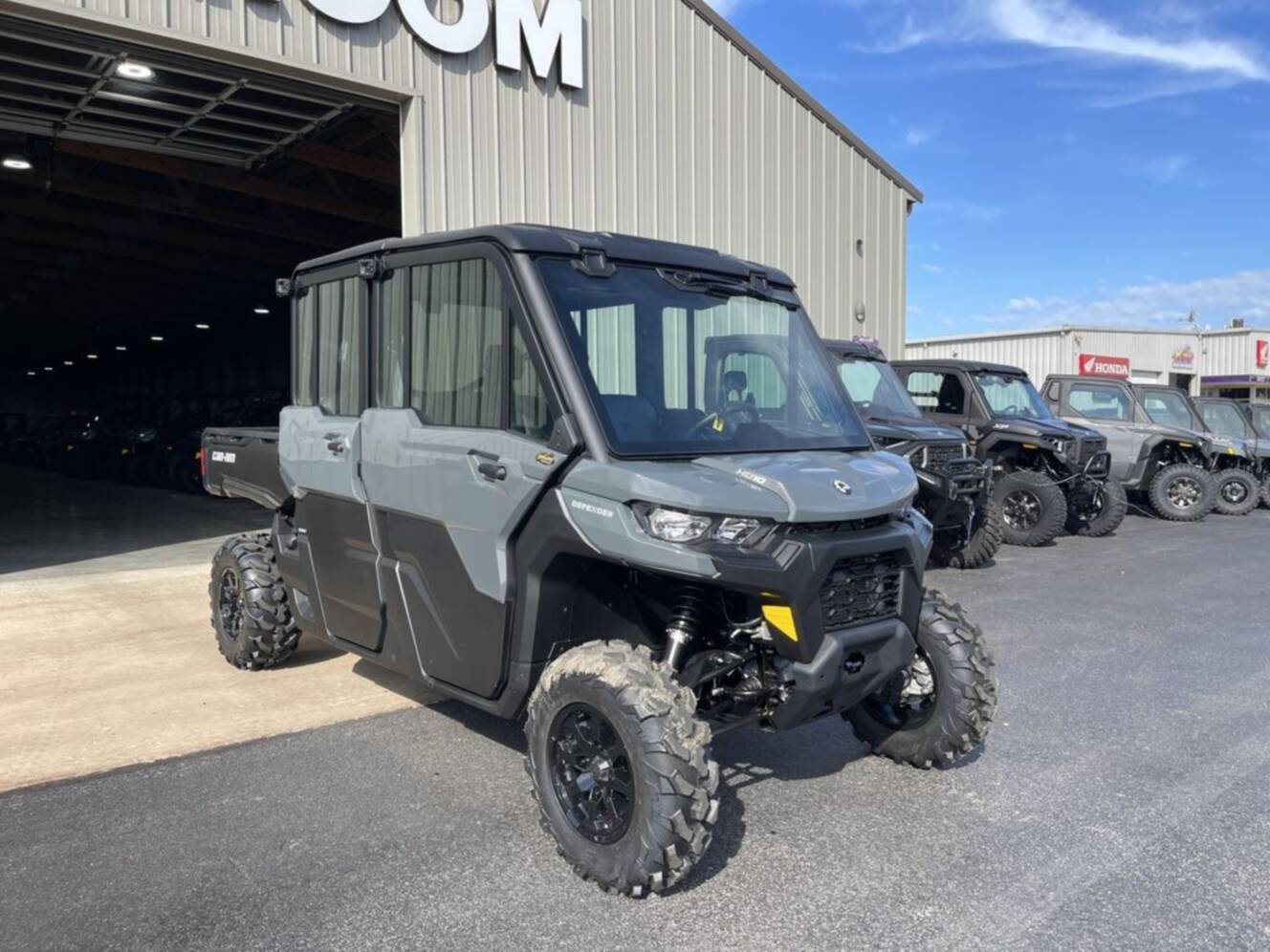 A photo of this 2027 Can-Am Defender MAX DPS CAB HD10 Dolomite Grey