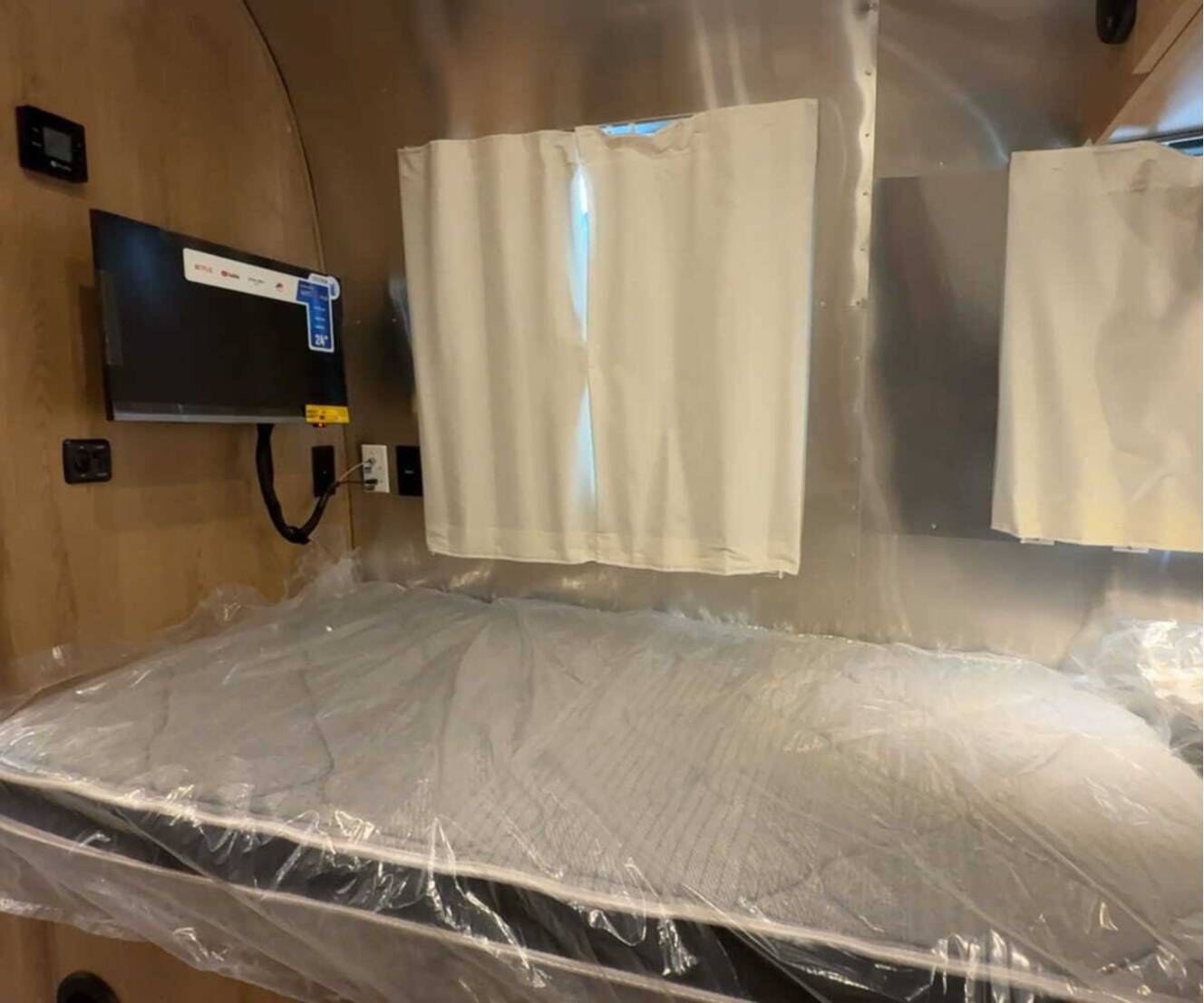 A photo of this 2027 Airstream Trade Wind 25FB Twin