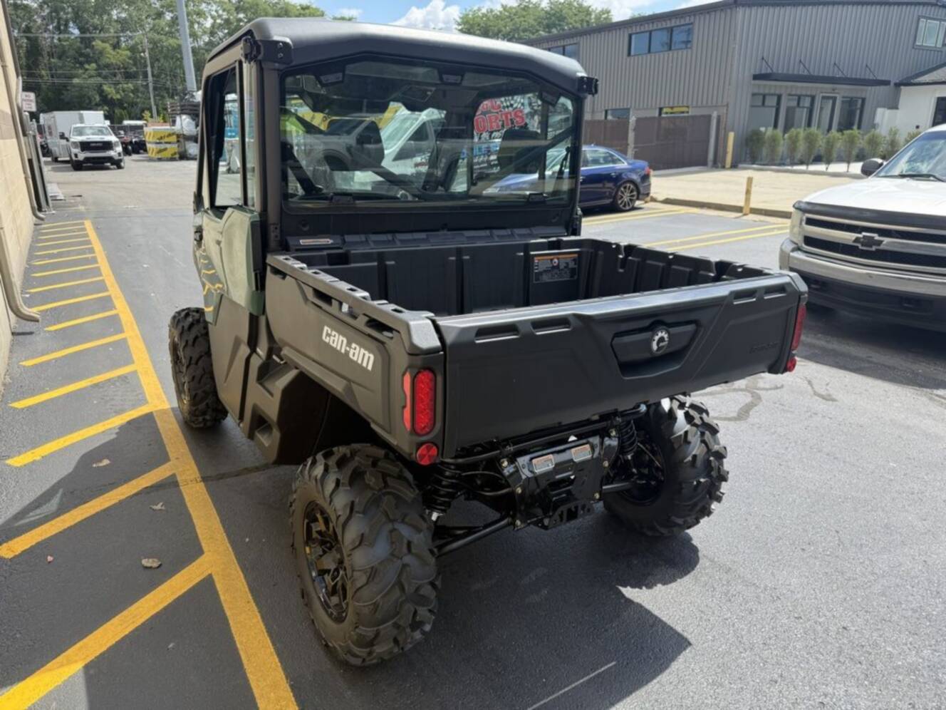 A photo of this 2027 Can-Am Defender DPS CAB HD10 Compass Green