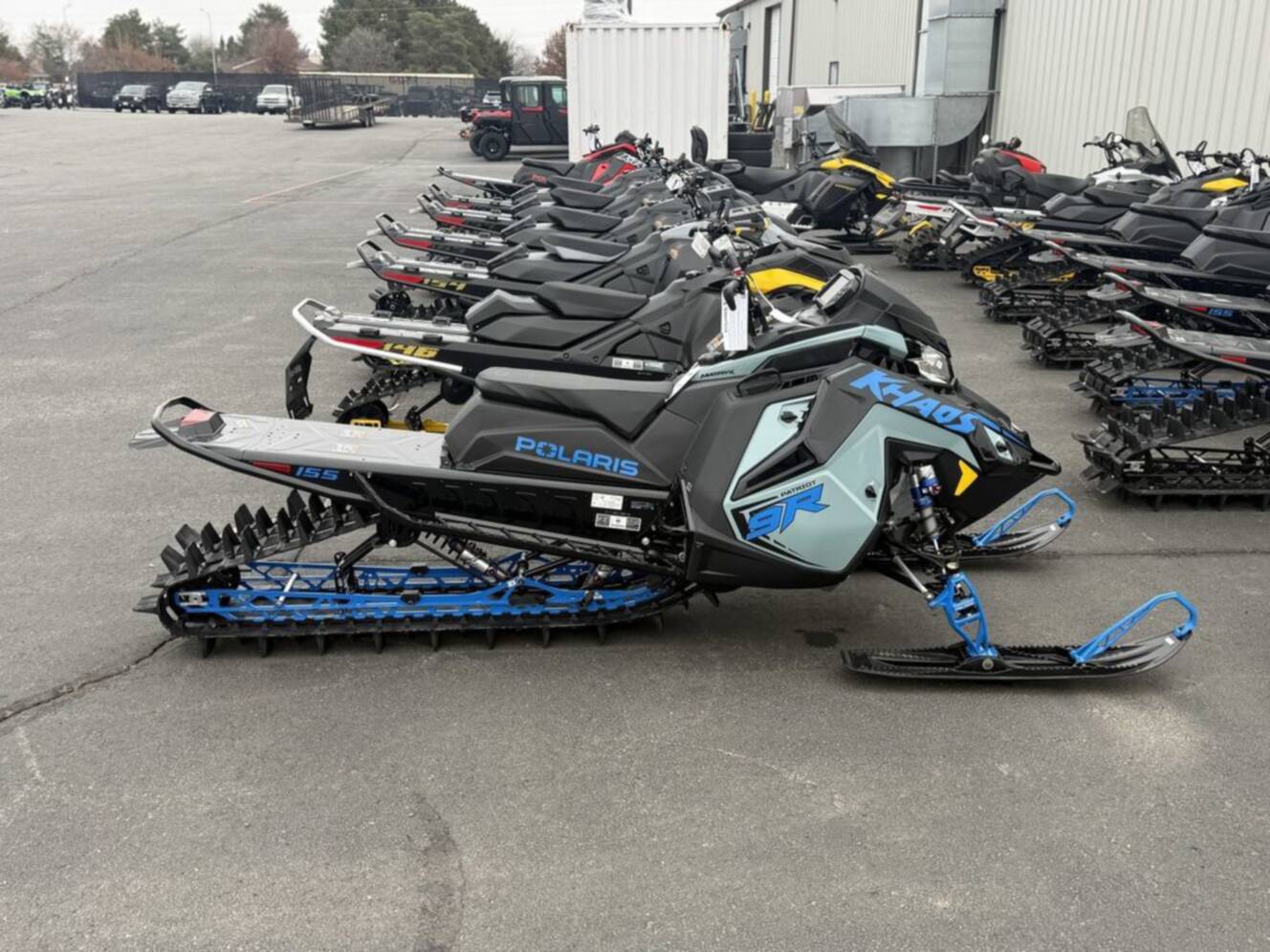 A photo of this 2026 Polaris Patriot 9R RMK Khaos 155 Premium Sagebrush Green Met / 