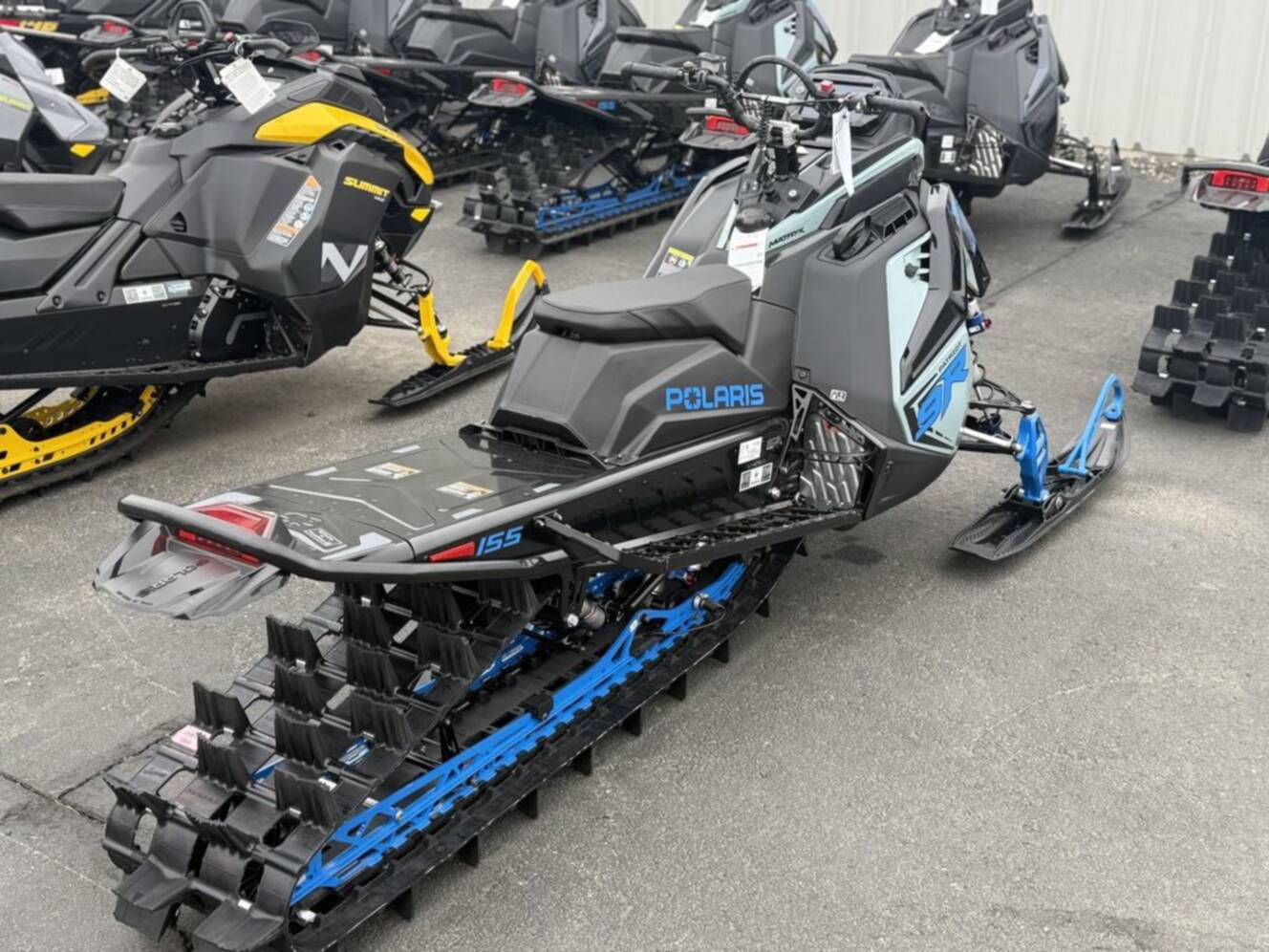 A photo of this 2026 Polaris Patriot 9R RMK Khaos 155 Premium Sagebrush Green Met / 