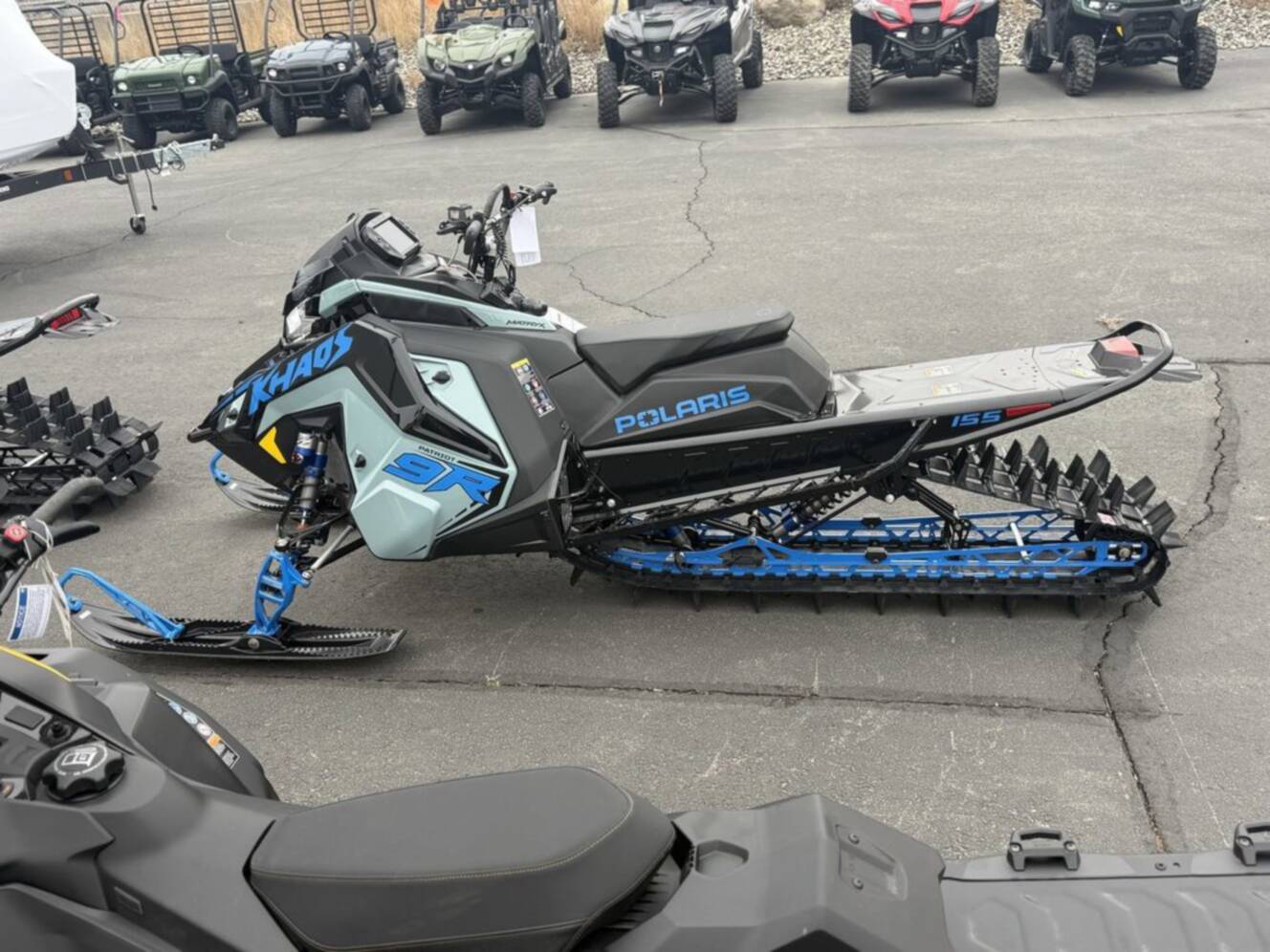 A photo of this 2026 Polaris Patriot 9R RMK Khaos 155 Premium Sagebrush Green Met / 