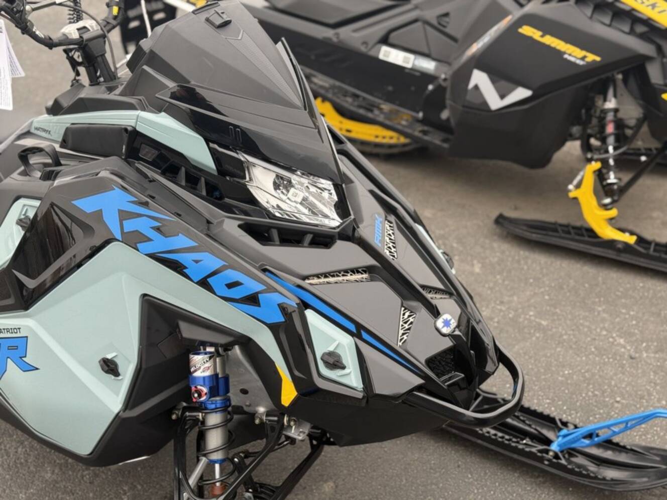 A photo of this 2026 Polaris Patriot 9R RMK Khaos 155 Premium Sagebrush Green Met / 
