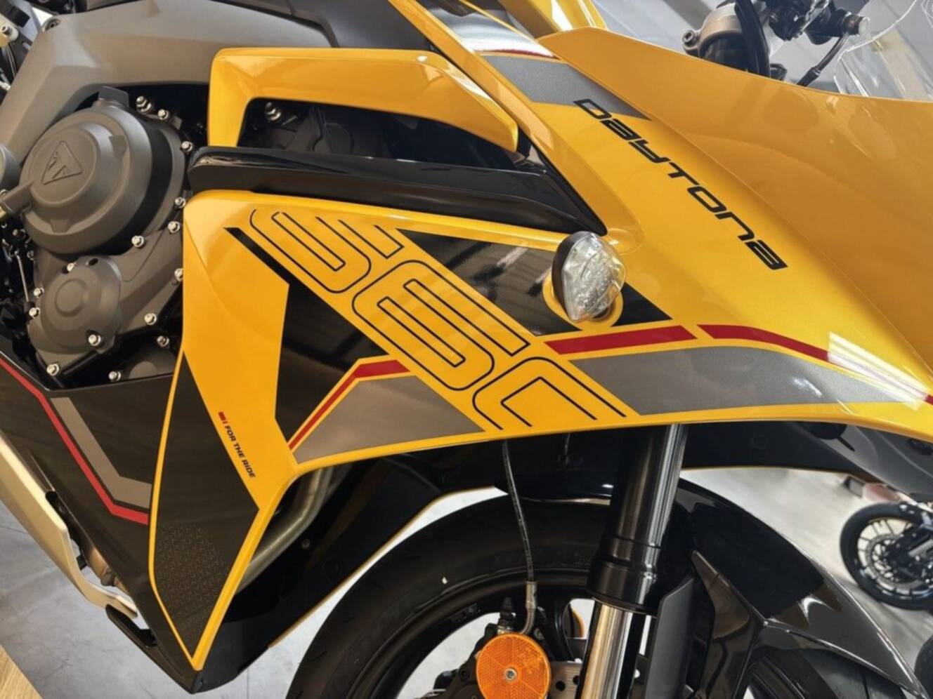A photo of this 2026 Triumph Daytona 660 Cosmic Yellow / Sapphire Black