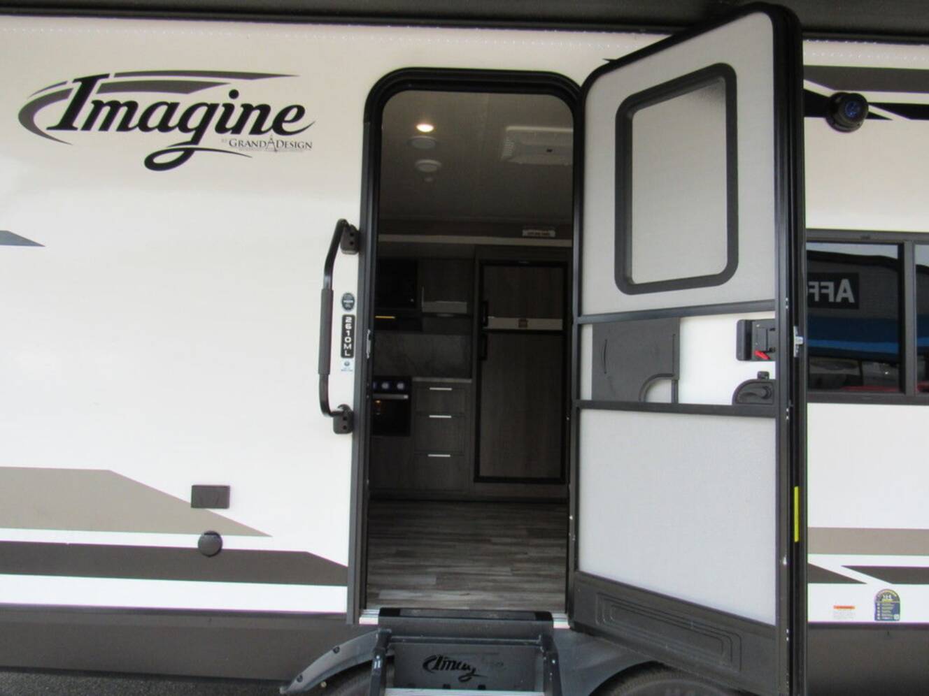 A photo of this 2021 Grand Design Imagine 2610ML