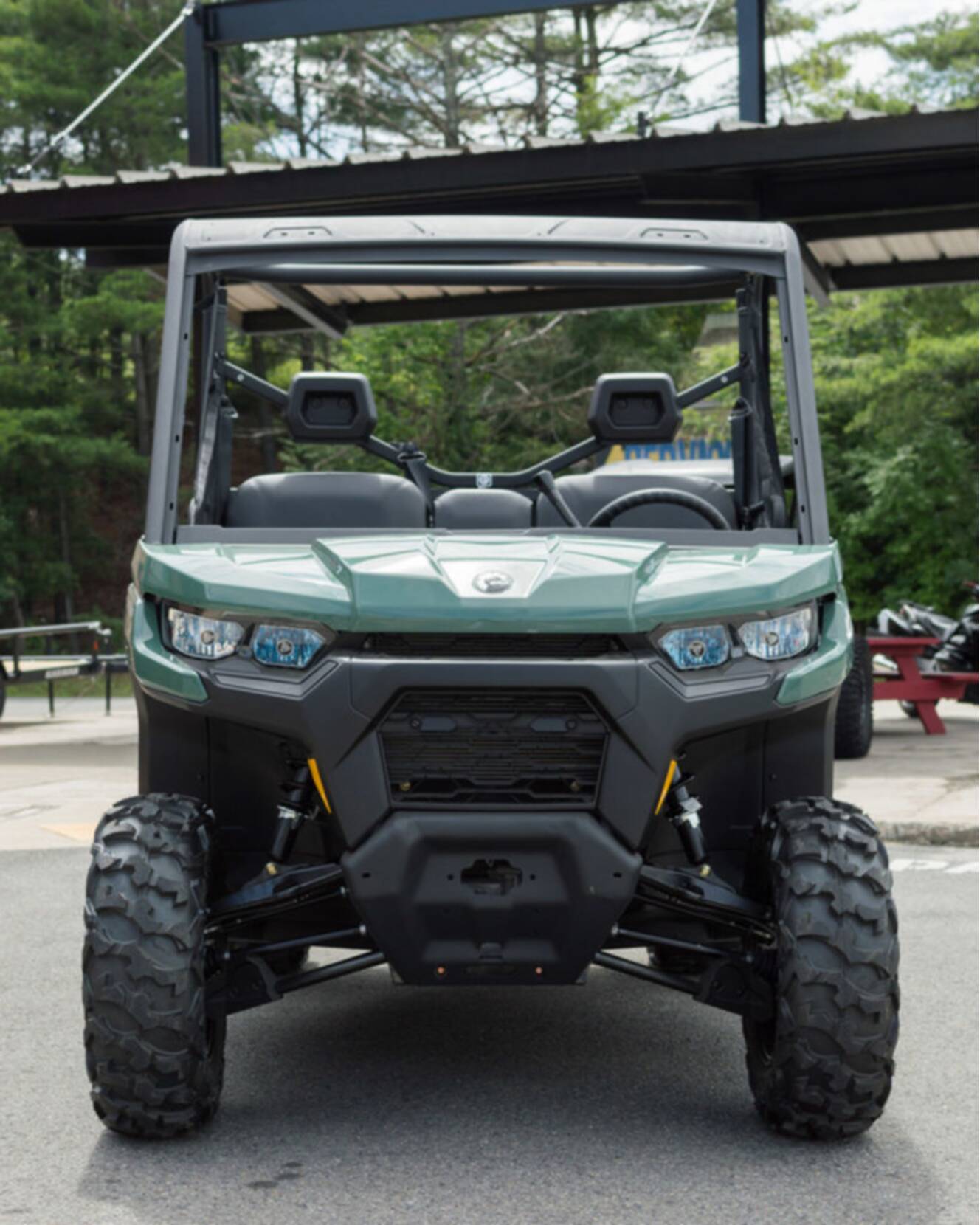 A photo of this 2026 Can-Am Defender DPS HD7 Compass Green