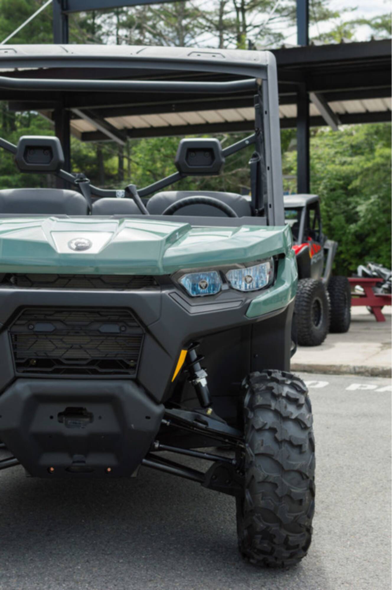 A photo of this 2026 Can-Am Defender DPS HD7 Compass Green