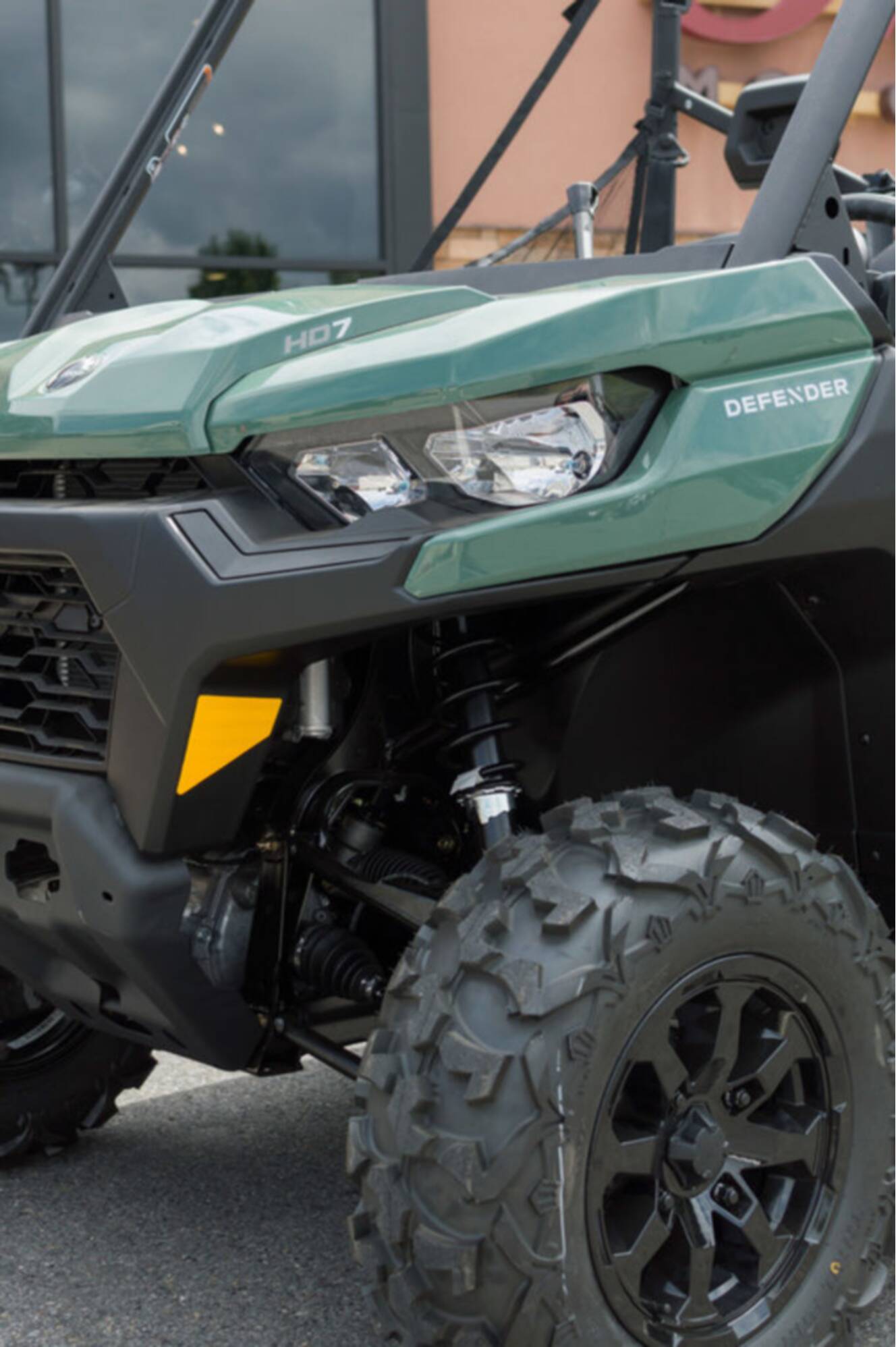 A photo of this 2026 Can-Am Defender DPS HD7 Compass Green