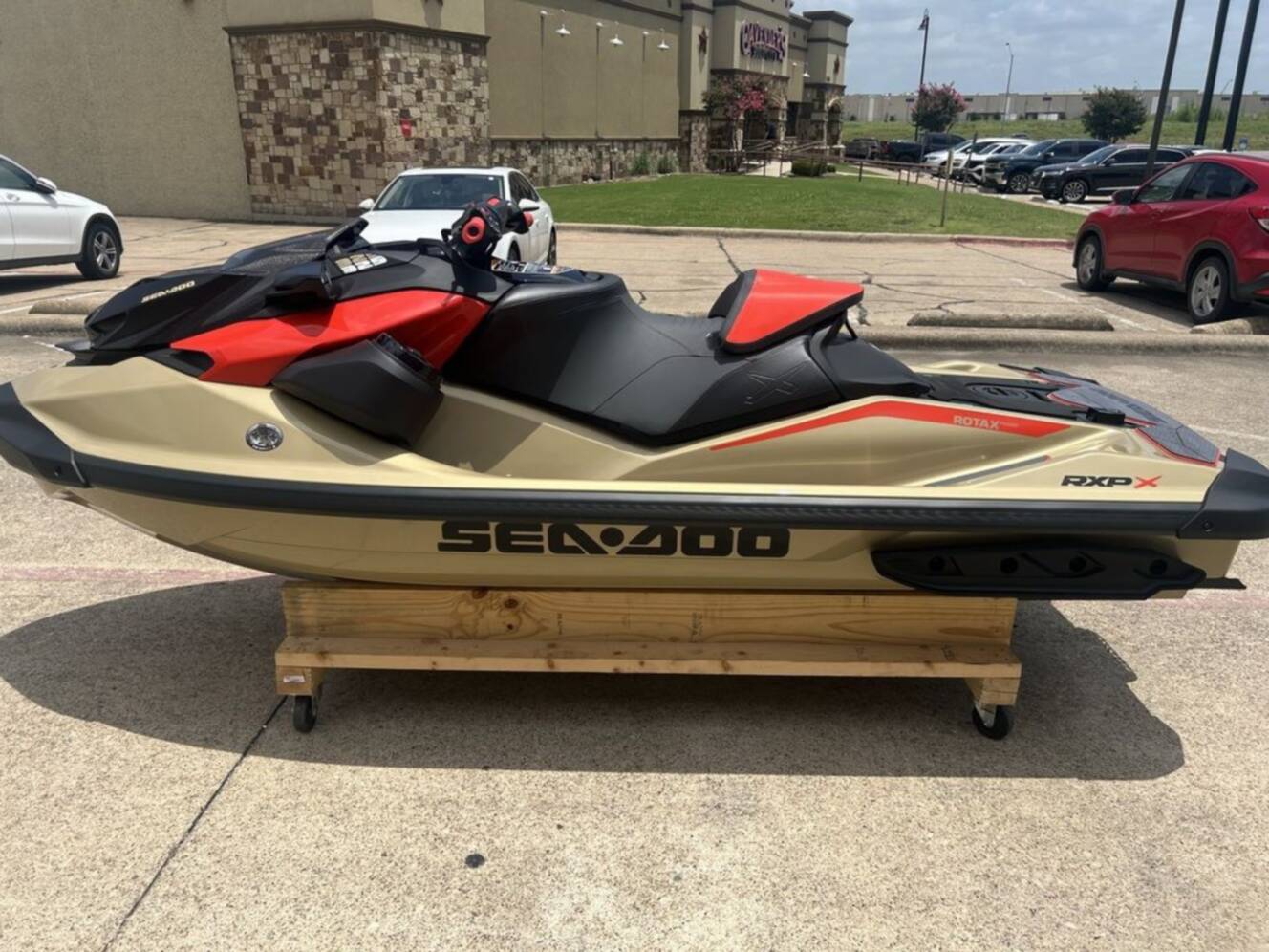 A photo of this 2025 Sea-Doo RXP-X 325 Tech, BRP Premium A, iBR Metallic Tan / La