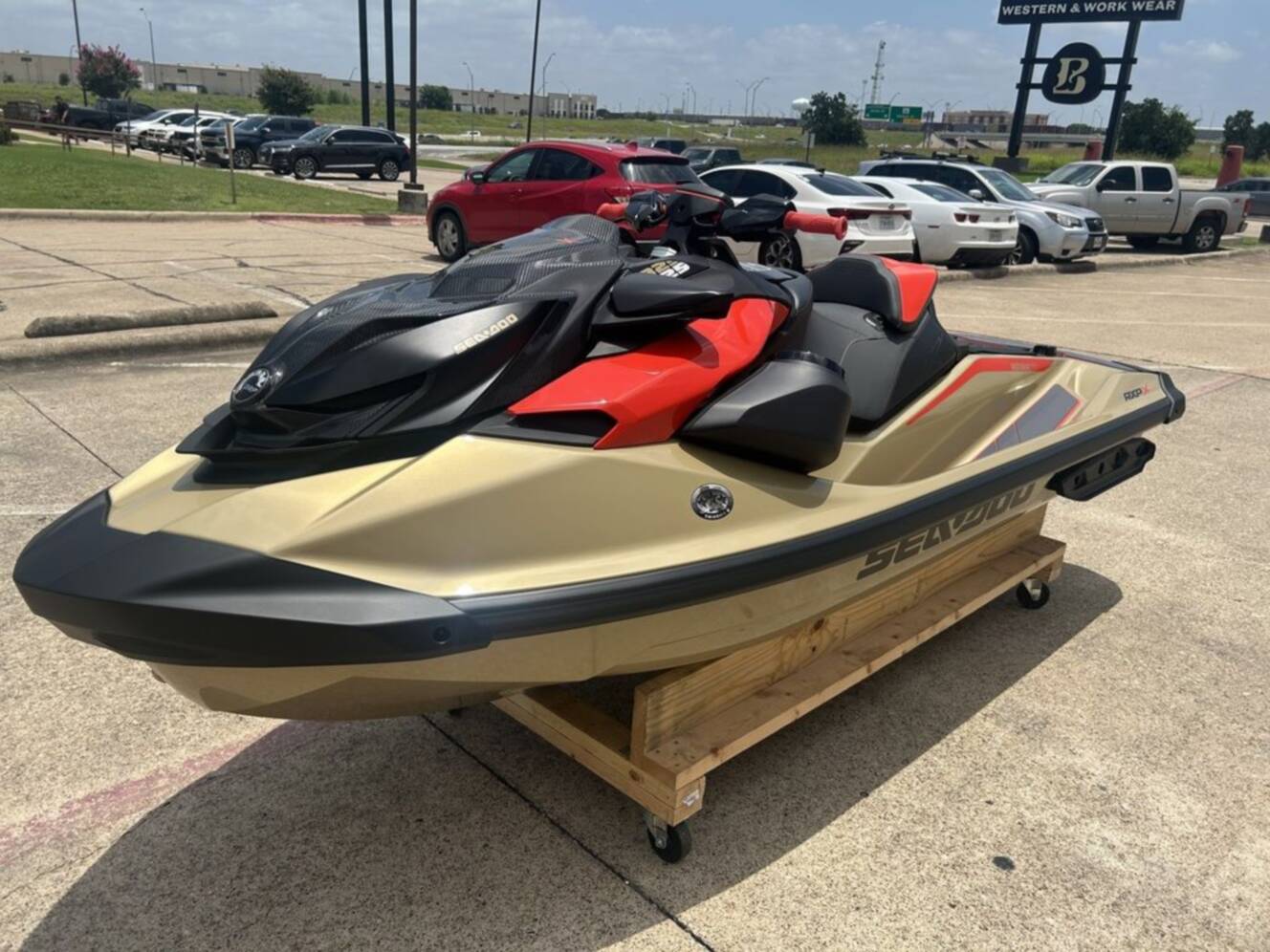 A photo of this 2025 Sea-Doo RXP-X 325 Tech, BRP Premium A, iBR Metallic Tan / La