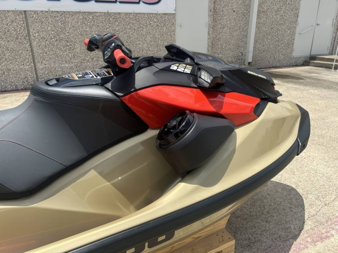 A photo of this 2025 Sea-Doo RXP-X 325 Tech, BRP Premium A, iBR Metallic Tan / La