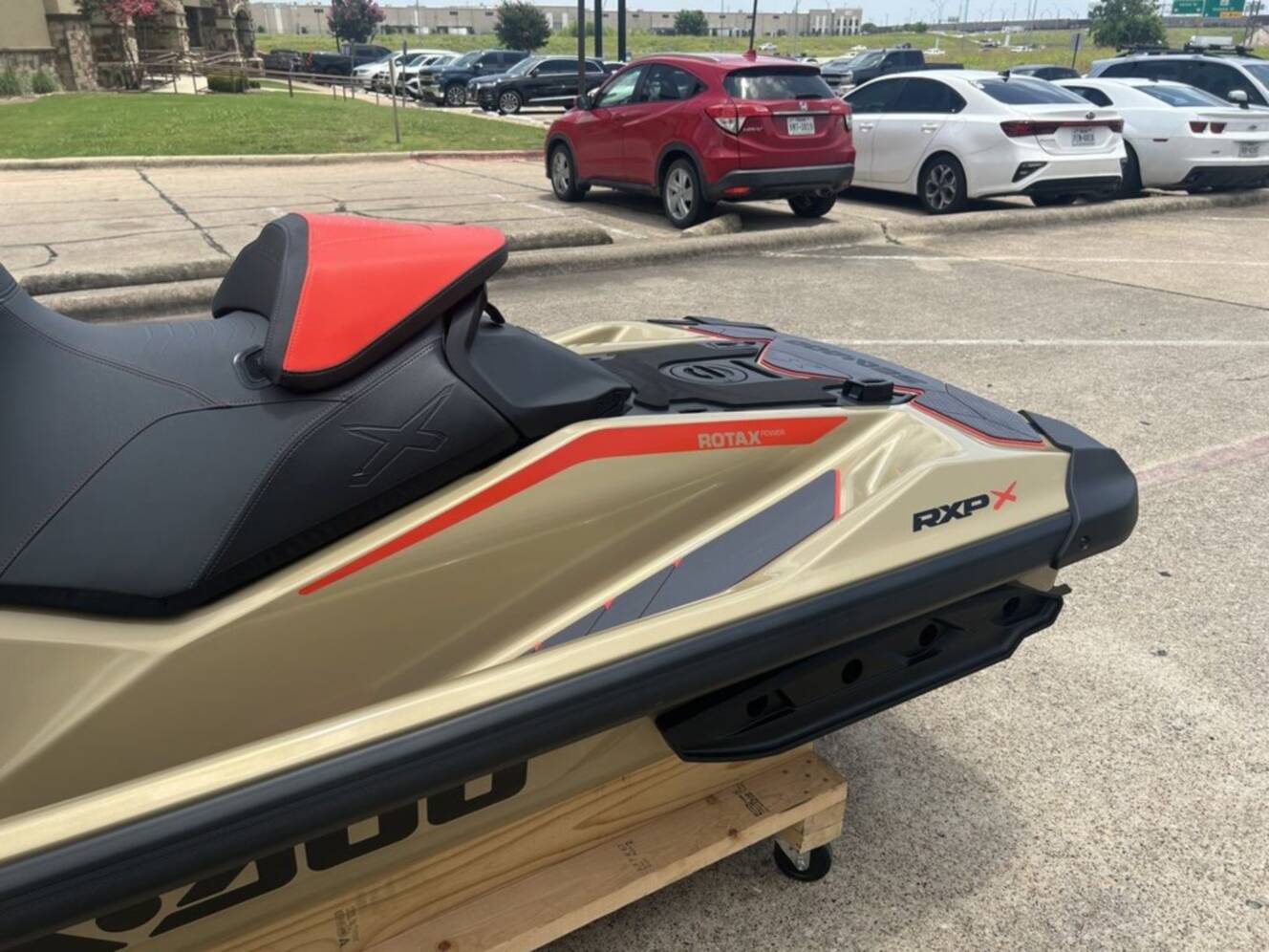 A photo of this 2025 Sea-Doo RXP-X 325 Tech, BRP Premium A, iBR Metallic Tan / La