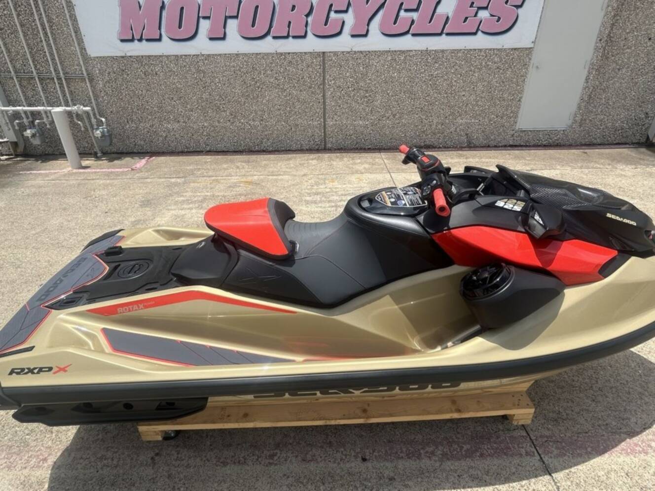 A photo of this 2025 Sea-Doo RXP-X 325 Tech, BRP Premium A, iBR Metallic Tan / La