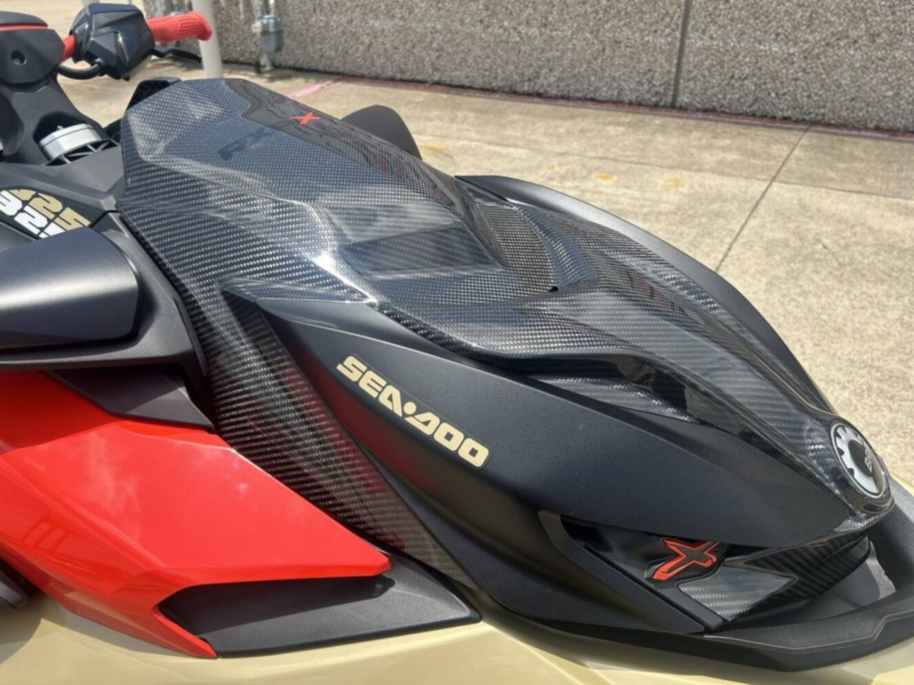 A photo of this 2025 Sea-Doo RXP-X 325 Tech, BRP Premium A, iBR Metallic Tan / La