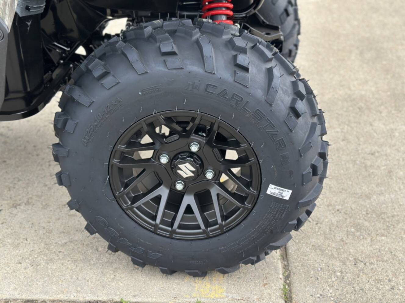A photo of this 2025 Suzuki KingQuad 500 AXi Power Steering SE Camo