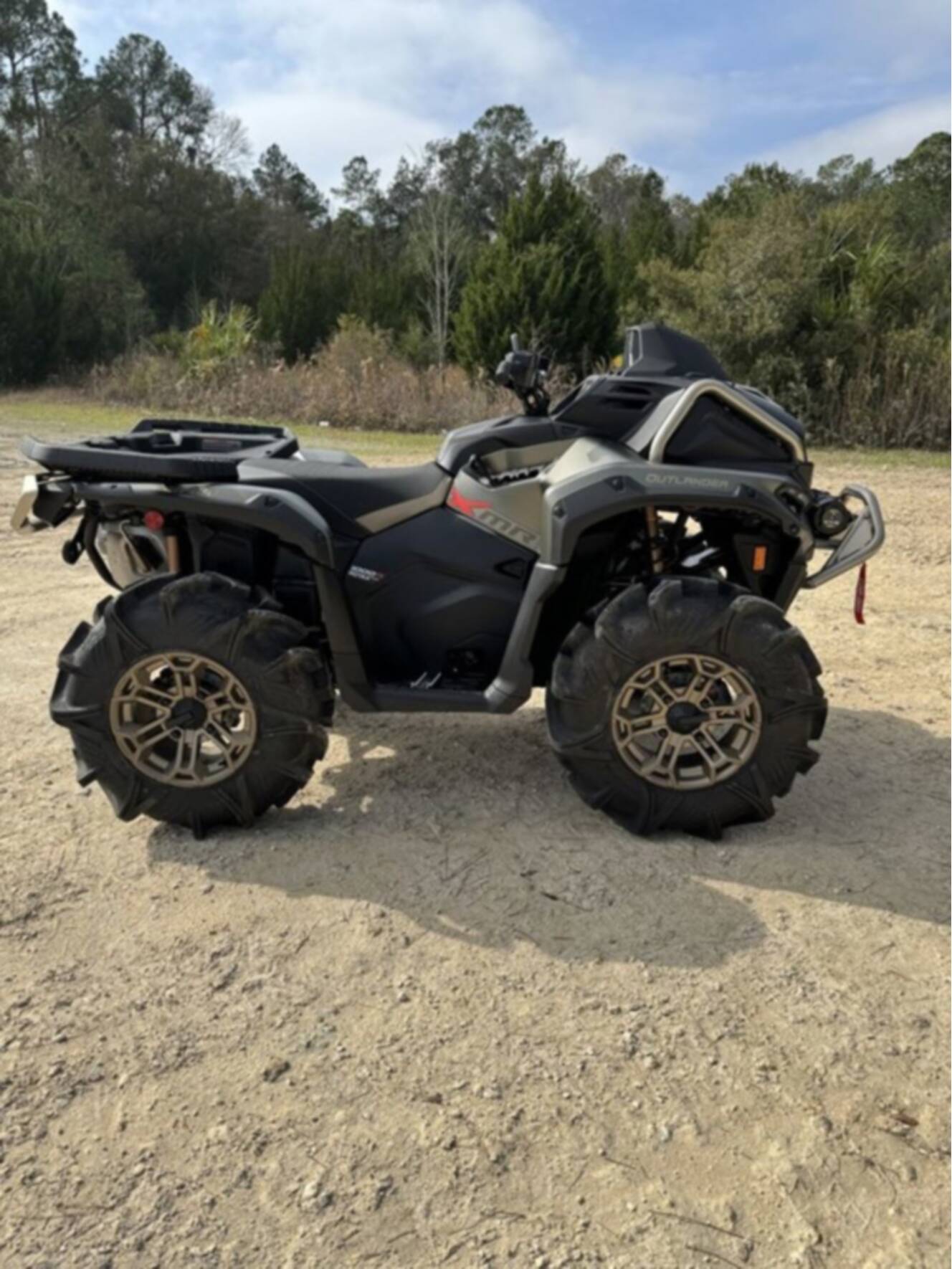 A photo of this 2026 Can-Am Outlander X Mr 1000R Loft Green Satin