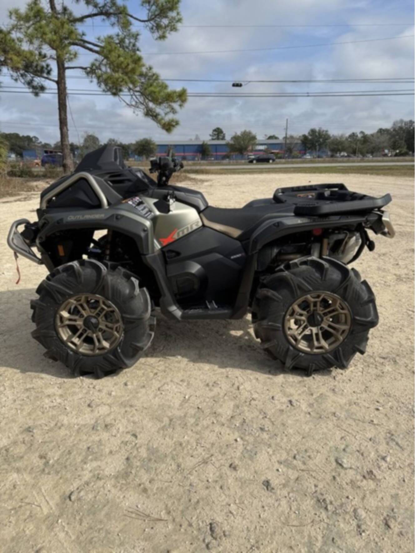A photo of this 2026 Can-Am Outlander X Mr 1000R Loft Green Satin