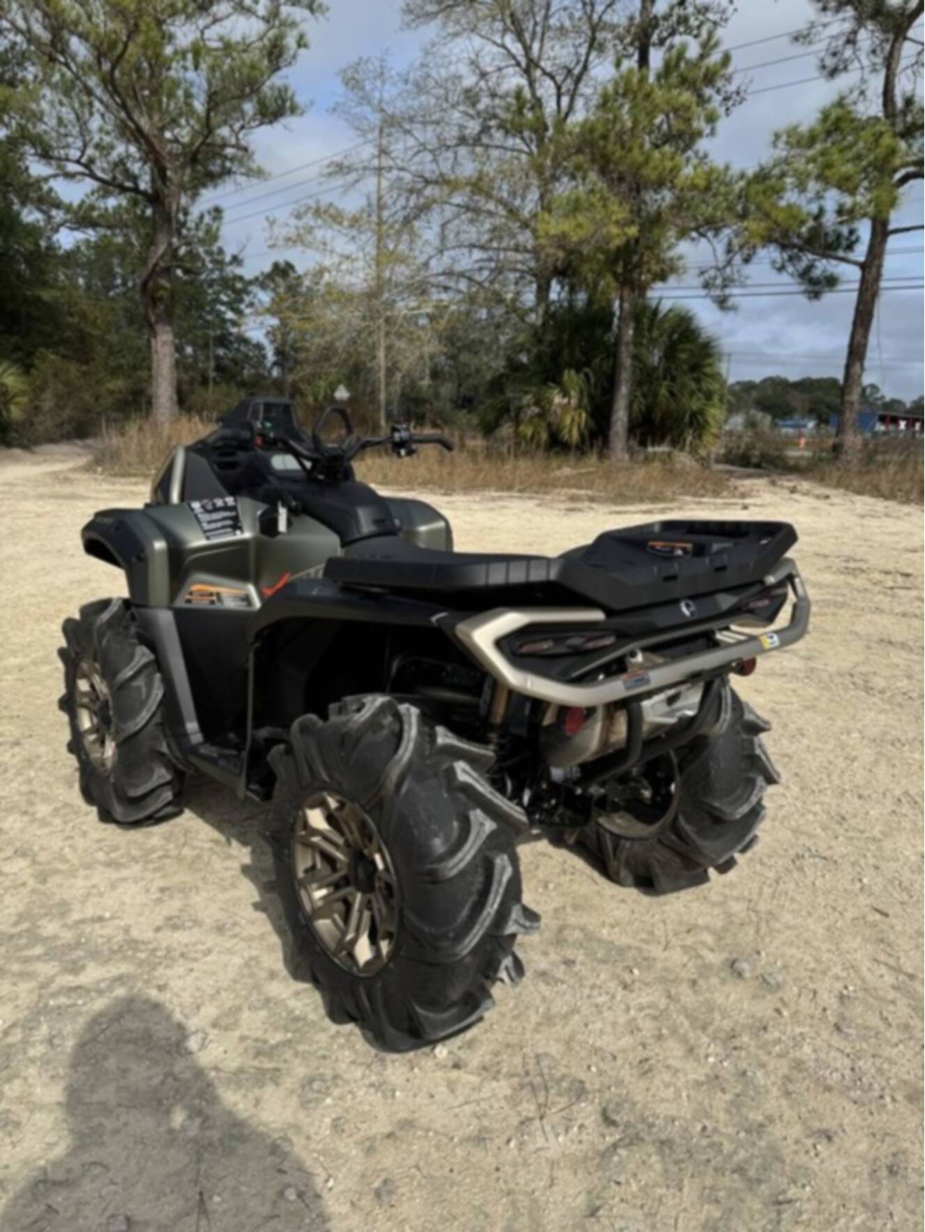 A photo of this 2026 Can-Am Outlander X Mr 1000R Loft Green Satin