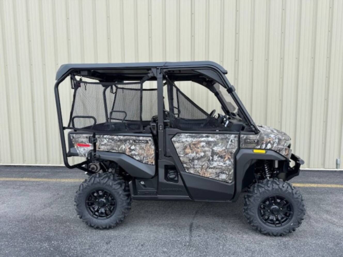 A photo of this 2026 Honda® Pioneer 1000-5 Deluxe TrueTimber Atera Camo