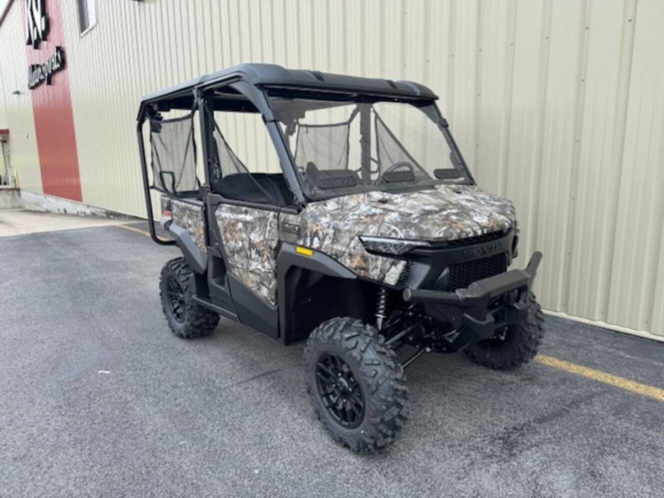 A photo of this 2026 Honda® Pioneer 1000-5 Deluxe TrueTimber Atera Camo