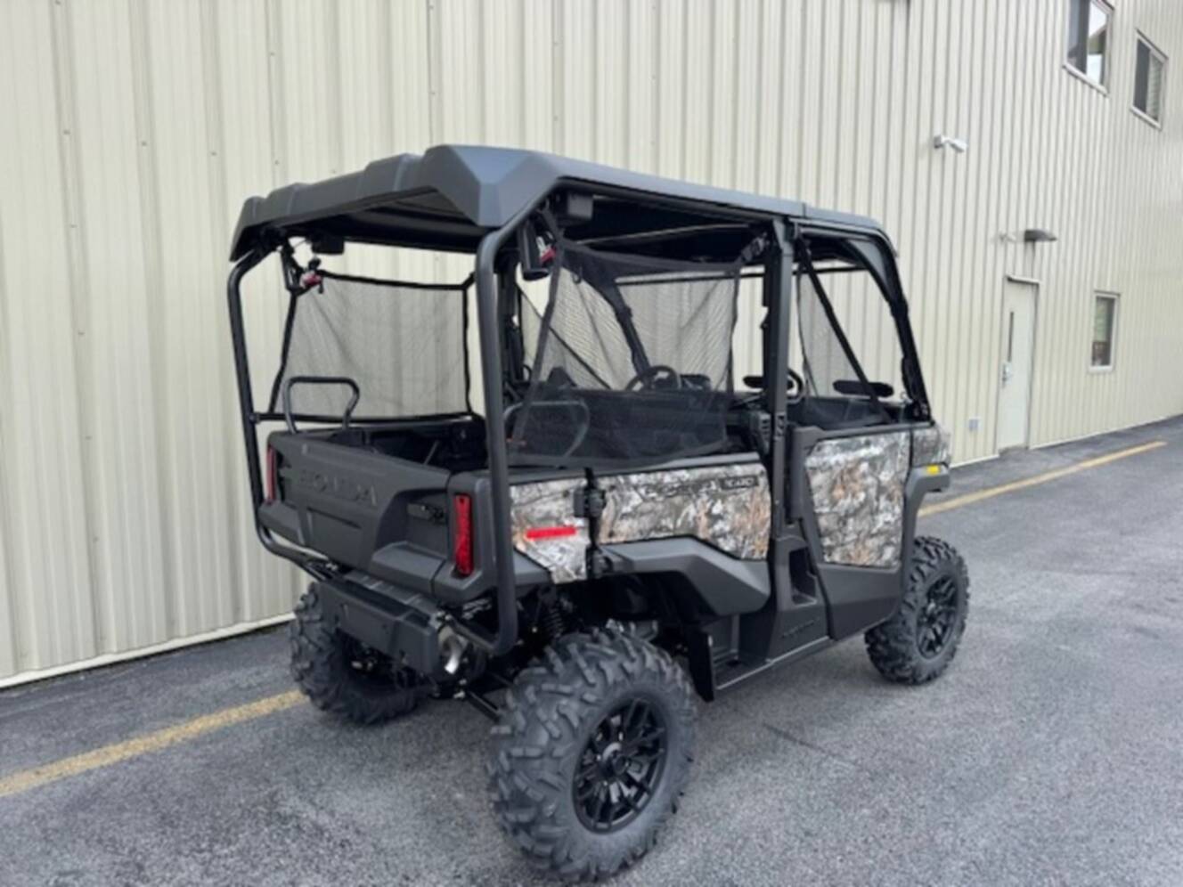 A photo of this 2026 Honda® Pioneer 1000-5 Deluxe TrueTimber Atera Camo