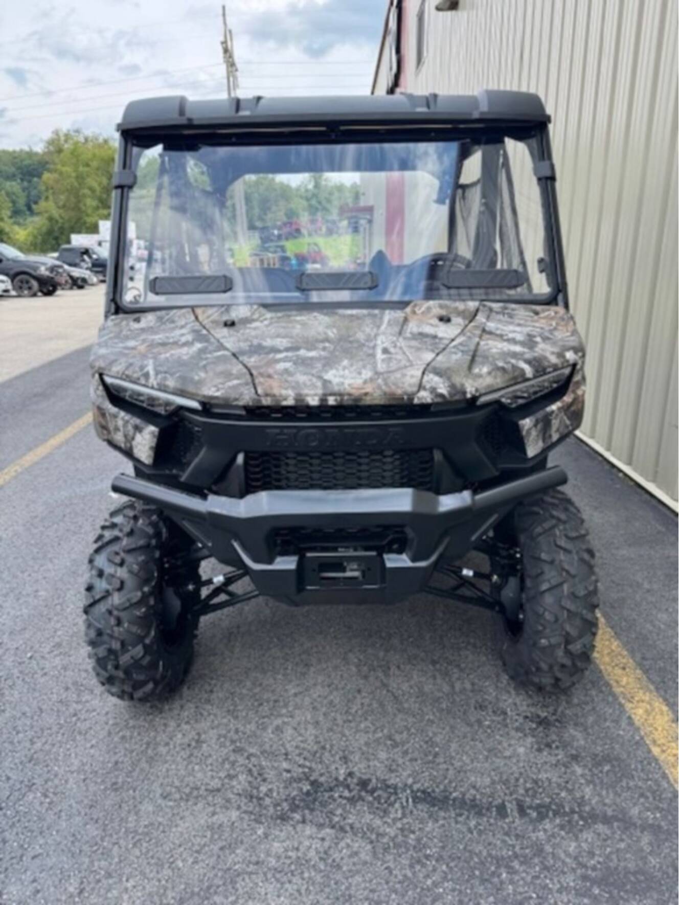 A photo of this 2026 Honda® Pioneer 1000-5 Deluxe TrueTimber Atera Camo
