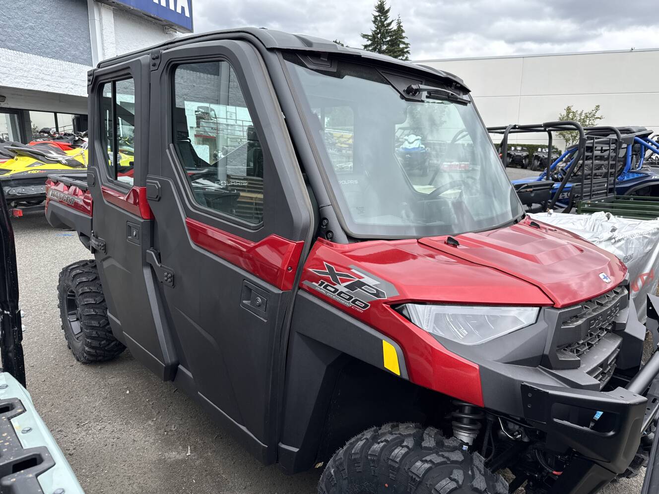 A photo of this 2026 Polaris RGR CREW XP 1000 NS ULTIMATE SUNSET RED Ultimate