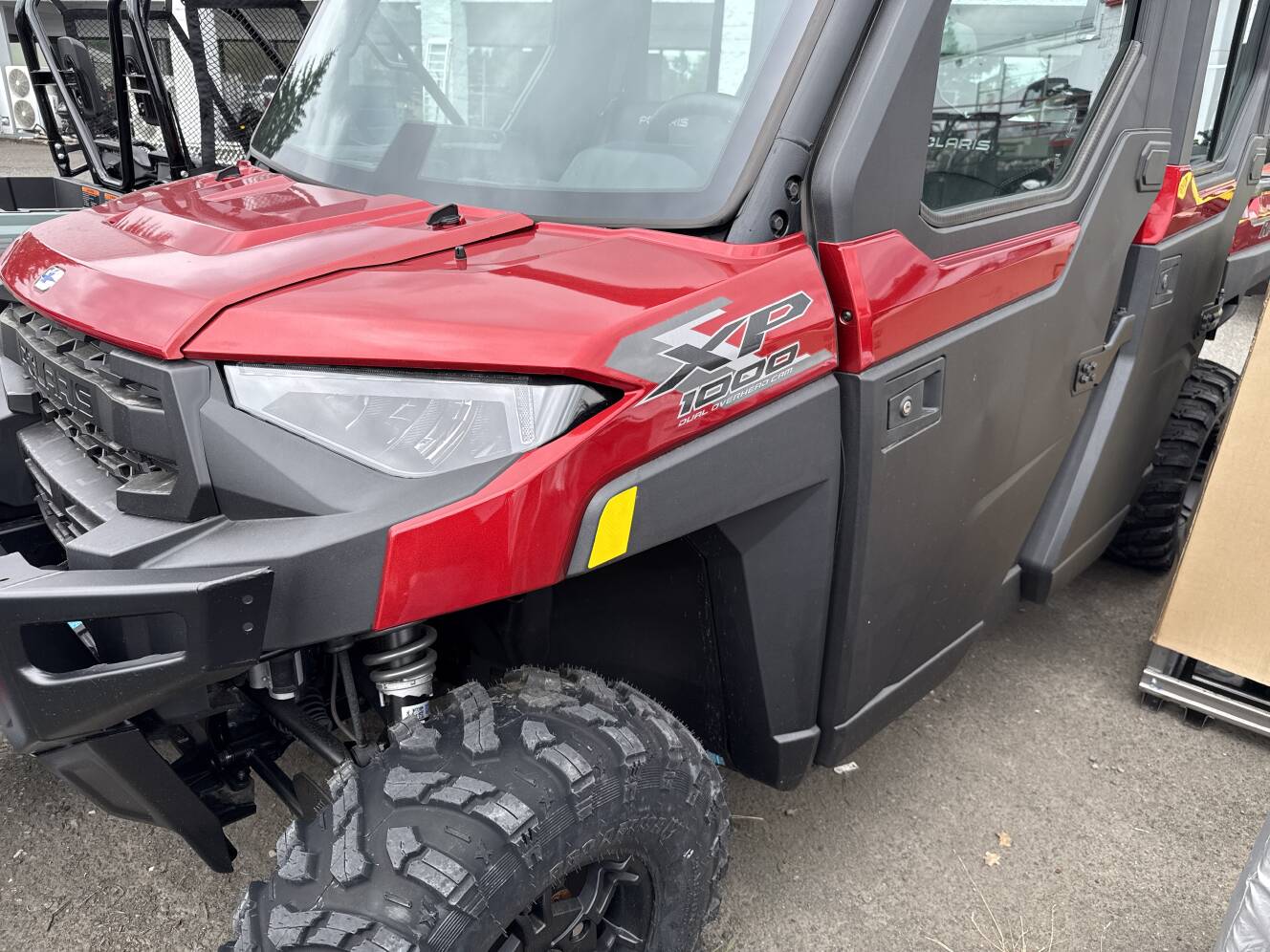 A photo of this 2026 Polaris RGR CREW XP 1000 NS ULTIMATE SUNSET RED Ultimate
