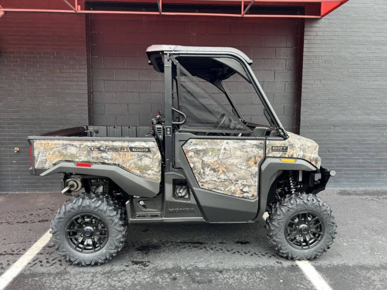 A photo of this 2026 Honda® Pioneer 1000 Deluxe TrueTimber atera camo