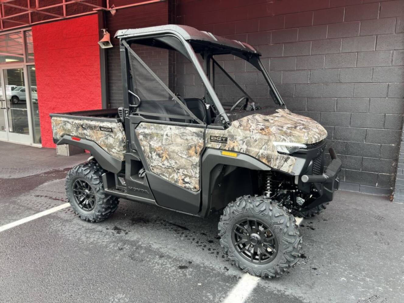A photo of this 2026 Honda® Pioneer 1000 Deluxe TrueTimber atera camo
