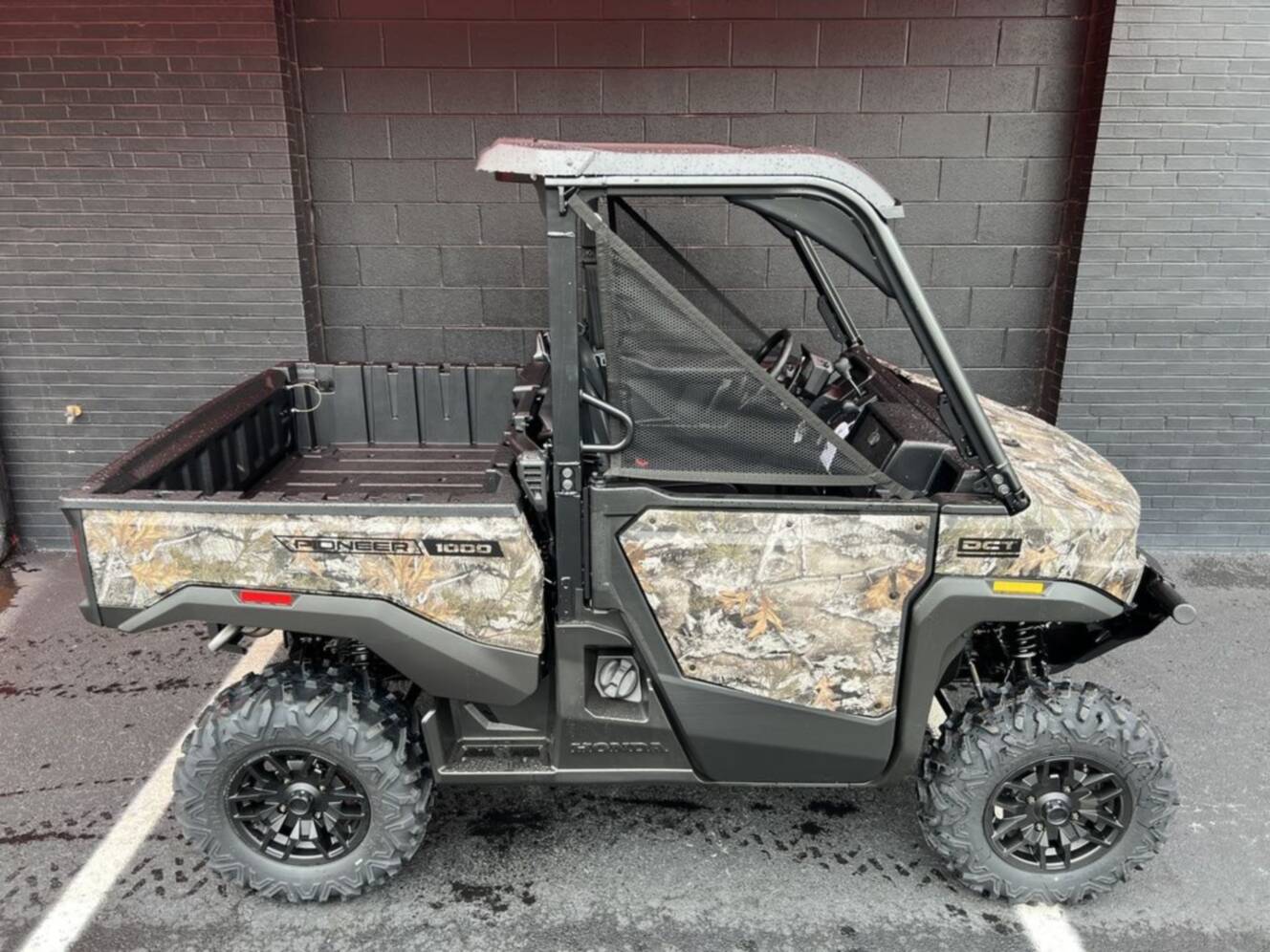 A photo of this 2026 Honda® Pioneer 1000 Deluxe TrueTimber atera camo