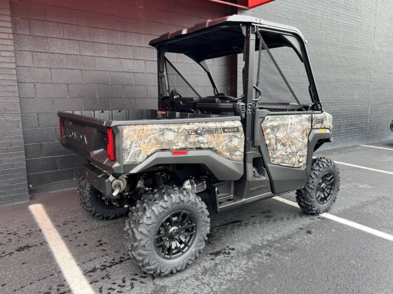 A photo of this 2026 Honda® Pioneer 1000 Deluxe TrueTimber atera camo