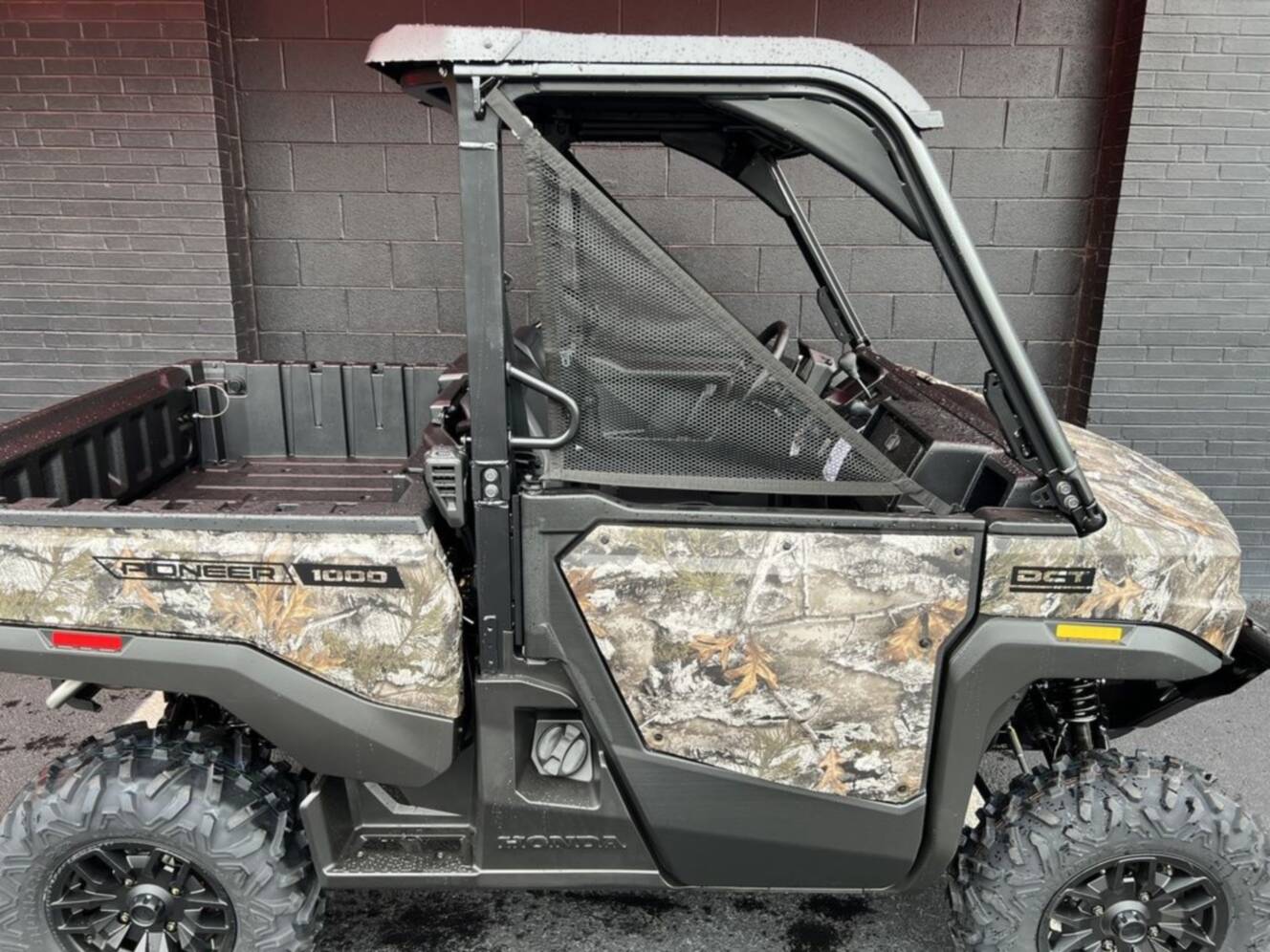 A photo of this 2026 Honda® Pioneer 1000 Deluxe TrueTimber atera camo