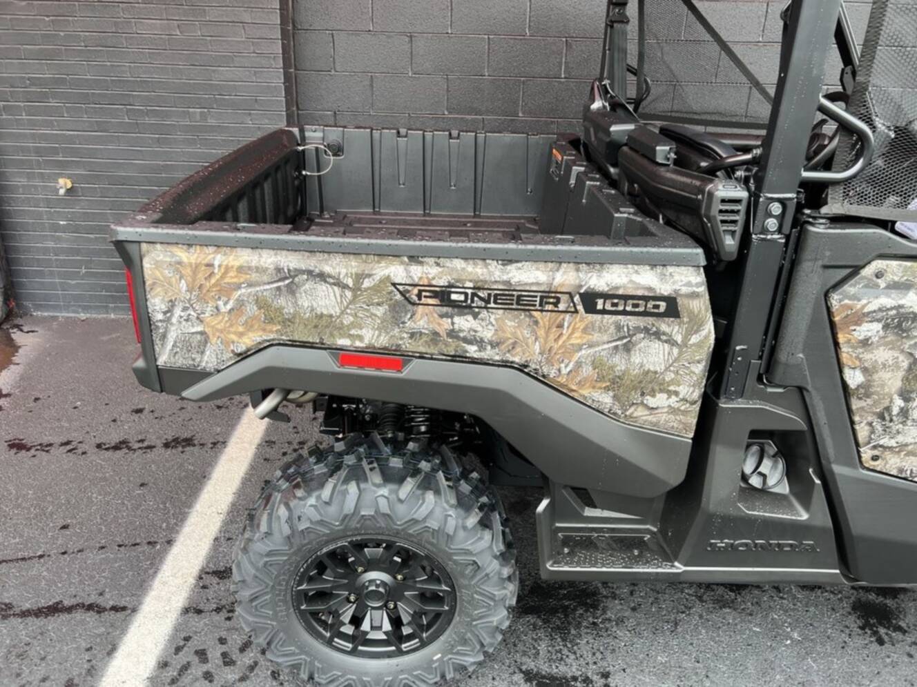 A photo of this 2026 Honda® Pioneer 1000 Deluxe TrueTimber atera camo