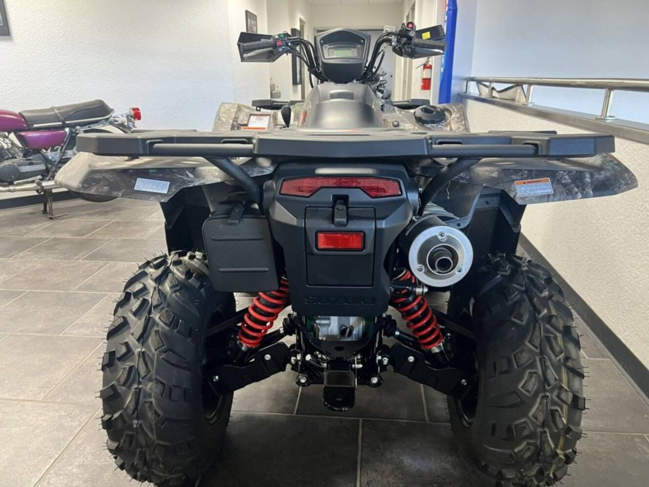 A photo of this 2025 Suzuki KingQuad 500AXi Power Steering SE Camo