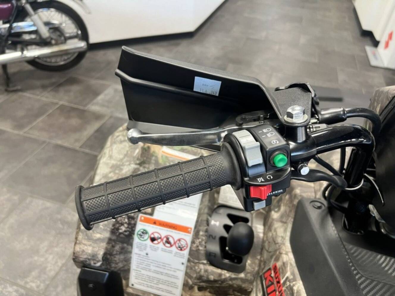 A photo of this 2025 Suzuki KingQuad 500AXi Power Steering SE Camo