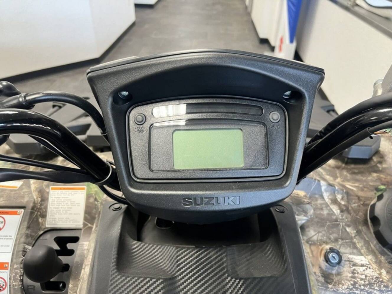 A photo of this 2025 Suzuki KingQuad 500AXi Power Steering SE Camo