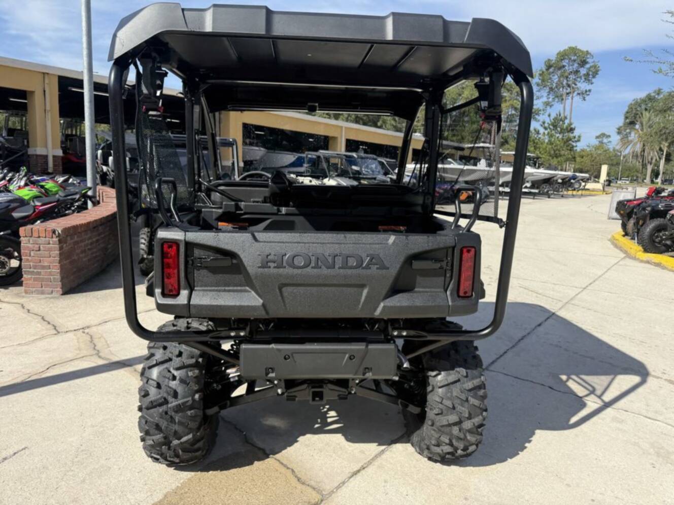 A photo of this 2026 Honda Pioneer 1000-5 Deluxe TrueTimber Atera Camo Deluxe
