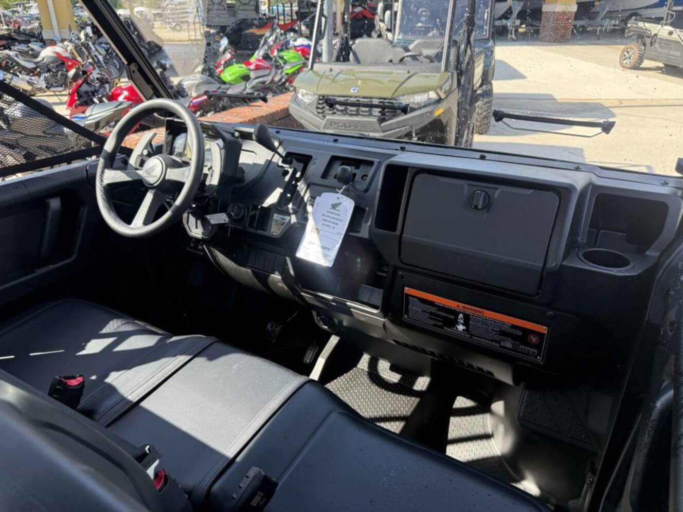 A photo of this 2026 Honda Pioneer 1000-5 Deluxe TrueTimber Atera Camo Deluxe