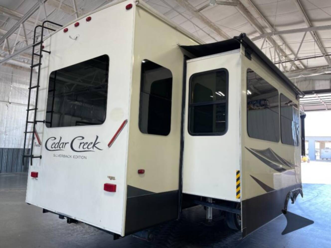 A photo of this 2019 Forest River Rv Cedar Creek Silverback 33IK