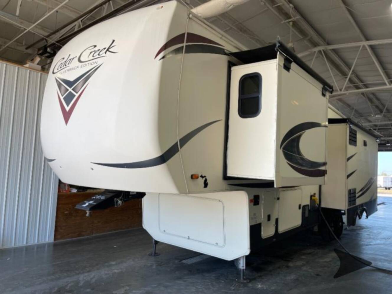 A photo of this 2019 Forest River Rv Cedar Creek Silverback 33IK