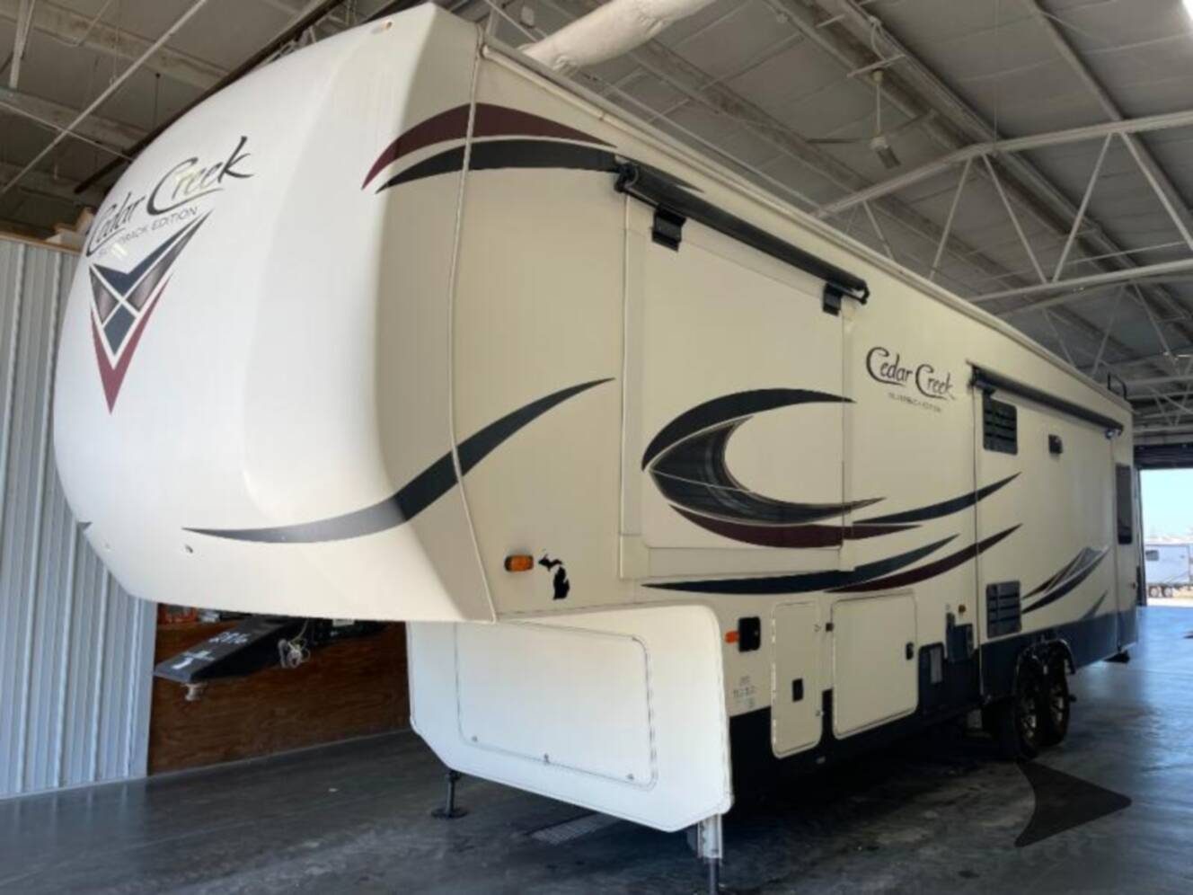 A photo of this 2019 Forest River Rv Cedar Creek Silverback 33IK