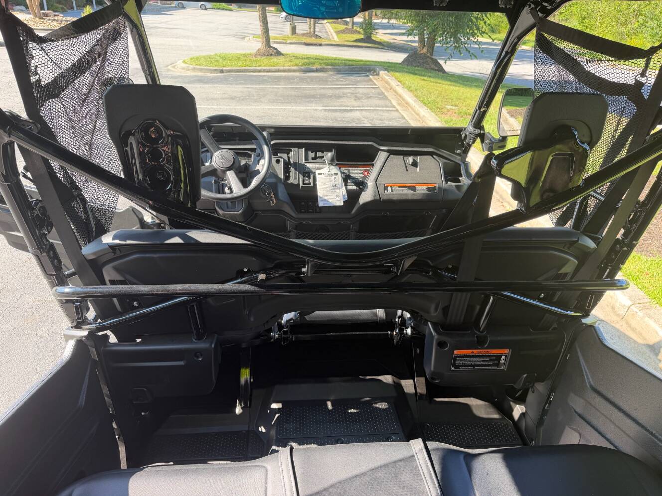 A photo of this 2025 Honda Pioneer 1000-6 Deluxe Crew