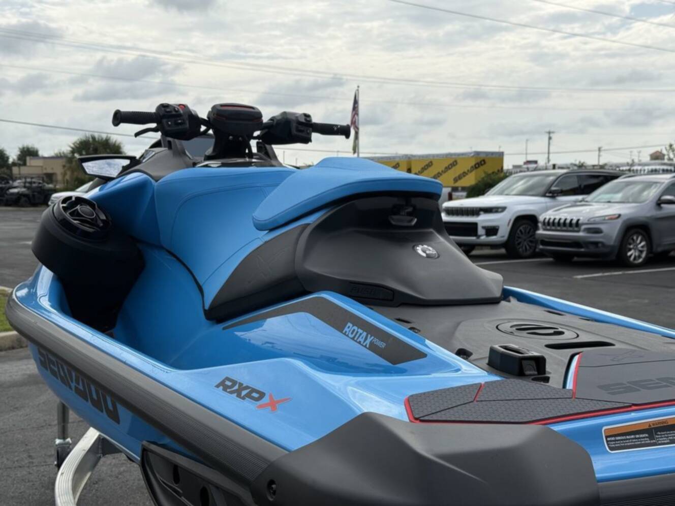 A photo of this 2026 Sea-Doo RXP-X 325 Tech, BRP Premium A, iBR Gulfstream Blue P