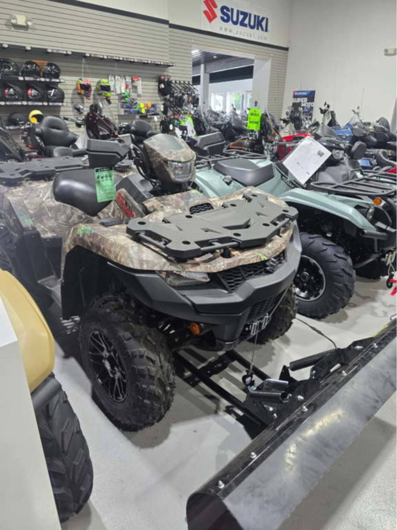 A photo of this 2025 Suzuki KingQuad 500AXi Power Steering SE Camo